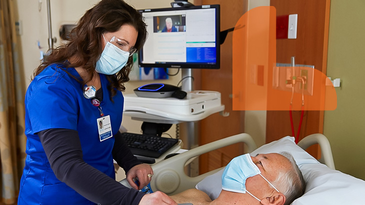 Cardiology nurse checking on patient at Rome Health in Rome New York