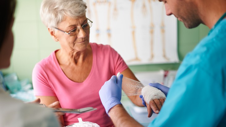 wound care image of senior woman getting treated at rome health near rome ny