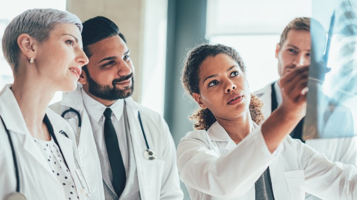 hospital jobs near rome ny image of doctors looking at x ray