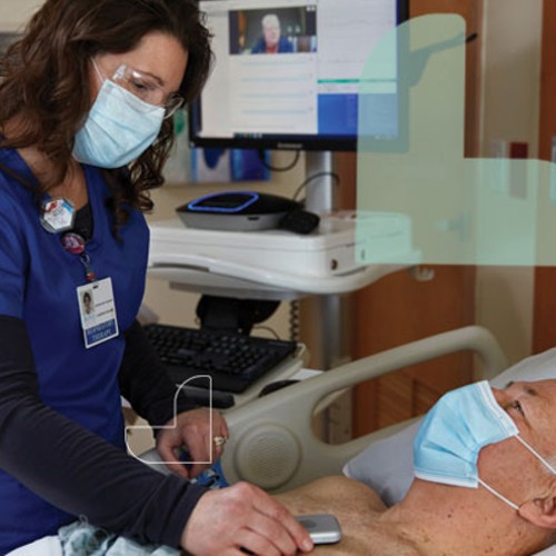 Bluetooth Stethoscope Connects Patients to St. Joseph’s Health Heart Specialists image of docotor using one on patient at rome health near rome ny