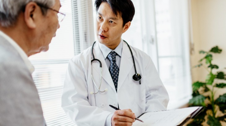 Medical Records Access hero unit image of male doctor talking to patient about records from rome health near rome ny