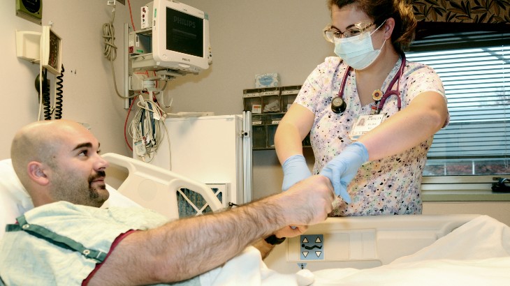 nursing care image of woman working with patient at rome health hospital near rome ny