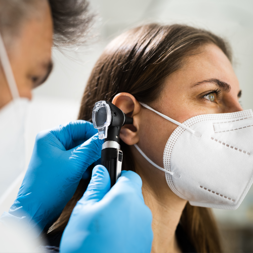 Otolaryngology physicians listing image of doctor examining patient at rome health near rome ny