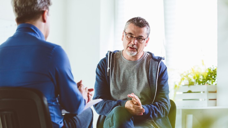Primary Care Provider image of patient talking to doctor at rome health near rome ny