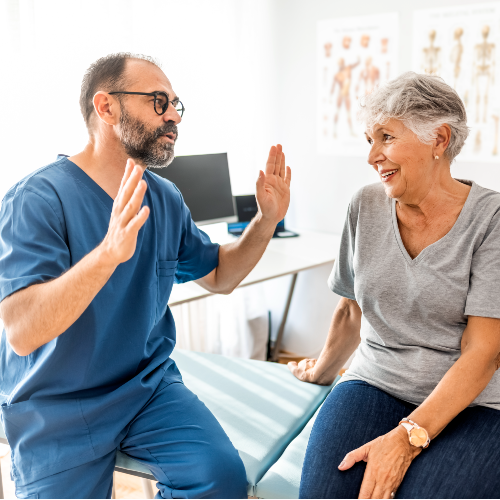 Orthopedic Surgeons listing image of doctor speaking to patient at rome health near rome ny