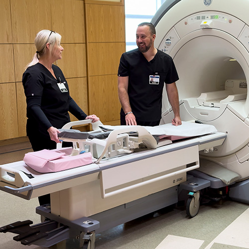 Radiology physicians listing image of doctors using MRI with patient at rome health near rome ny